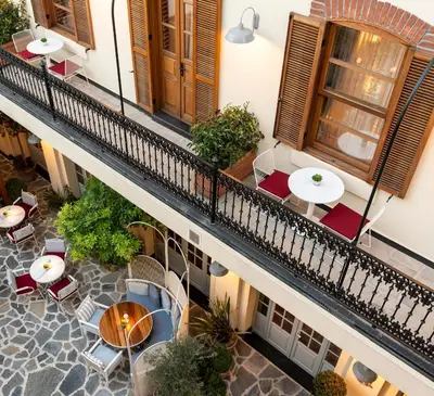 an overhead view of a balcony with tables and chairs at Ecole St. Pierre Hotel in Istanbul