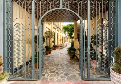 an entrance to a building with an iron gate at Ecole St. Pierre Hotel in Istanbul
