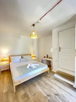 a bedroom with a bed in a room at Ikigai Hotel Villa Rıfat in Adalar