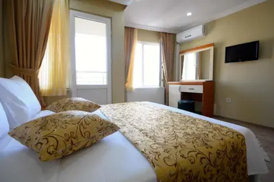 a bedroom with a bed with two pillows on it at Marida Residence - Istanbul Taksim in Istanbul