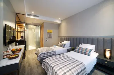 a hotel room with two beds and a table at Dosso Dossi Hotels Yenikapı in Istanbul