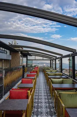 a row of tables and chairs on a balcony at Grand Balyan Hotel & Restaurant in Istanbul