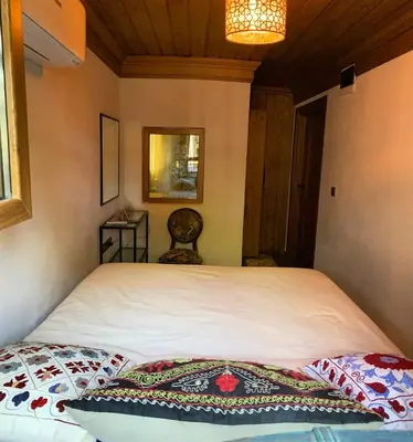 a bedroom with a large white bed with two pillows at Sofia Konaklama in Istanbul