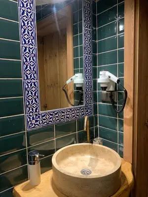 a bathroom with a sink and a mirror at Sofia Konaklama in Istanbul