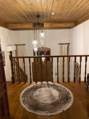 a room with a staircase with a rug on the floor at Sofia Konaklama in Istanbul