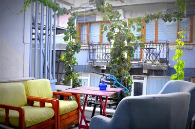a patio with a table and chairs on a balcony at Mimoza İstiklal Apart Hotel in Istanbul