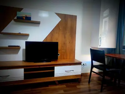 a room with a desk with a television on it at Mimoza İstiklal Apart Hotel in Istanbul