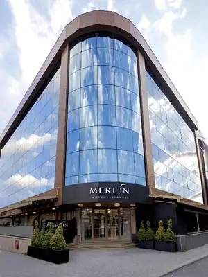 a large glass building with a merlin sign on it at Merlin Hotel İstanbul in Istanbul
