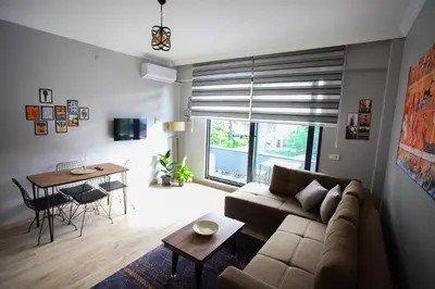a living room with a couch and a table at Bahçeli Concept Sapanca in Sapanca