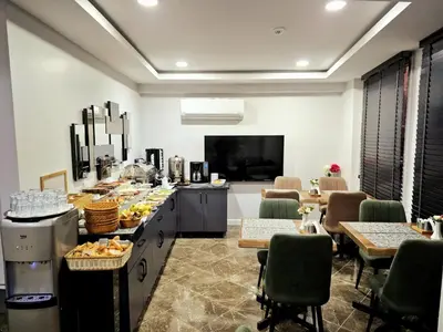 a buffet in a room with tables and chairs at Cape Palace Hotel in Istanbul