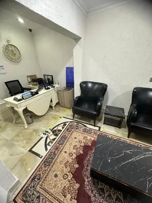 an office with a desk and two chairs and a table at Big Orange Hotel Old City in Istanbul