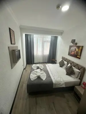 a bedroom with a large bed in a room at Big Orange Hotel Old City in Istanbul