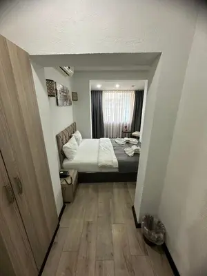 a small room with a bed and a window at Big Orange Hotel Old City in Istanbul