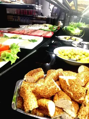 a buffet with plates of food on a table at Gafa Garden Hostel & Apartments - Great Location in Istanbul