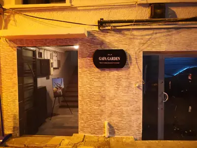 a sign on the side of a brick building at Gafa Garden Hostel & Apartments - Great Location in Istanbul