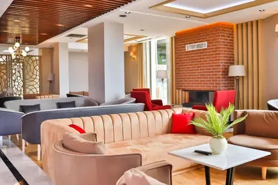 a waiting room with couches and a fireplace at The Sign Degirmen Hotel&Spa Wellness in Istanbul