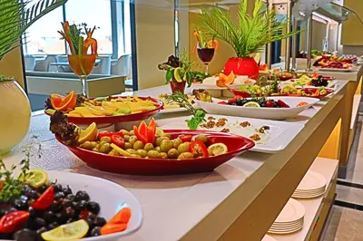 a buffet with many plates of food on a table at The Sign Degirmen Hotel&Spa Wellness in Istanbul