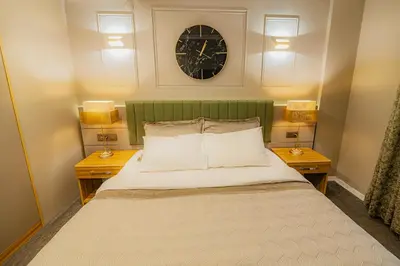 a bedroom with a large bed with two night stands at La Palace Exclusive Design in Istanbul