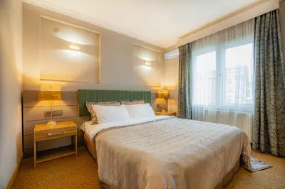a hotel room with a bed and a window at La Palace Exclusive Design in Istanbul
