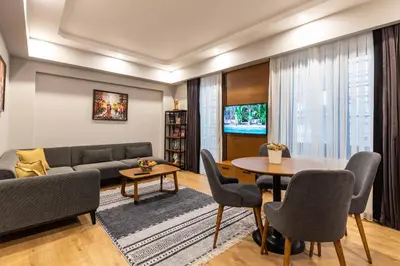a living room with a couch and a table at SALA SUITES in Istanbul