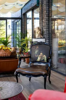 a chair with a picture of a man on it at LAGUN CASTLE HOTEL&SPA in Yalova