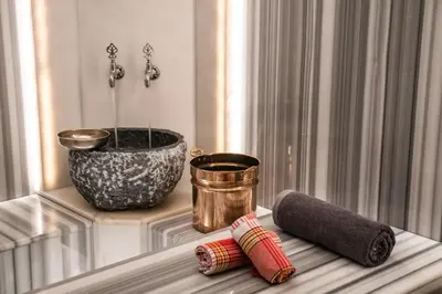 a window sill with a vase and two rolls of thread at Four Points by Sheraton Istanbul Kagithane in Istanbul