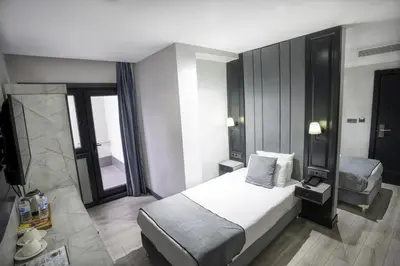 a bedroom with a bed and a television in it at Express Plus Hotel in Istanbul