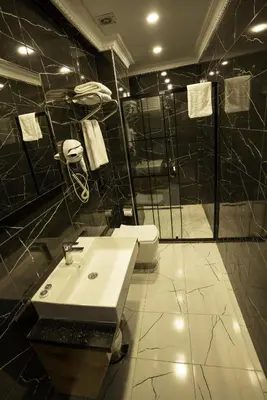 a bathroom with a sink and a shower at Express Plus Hotel in Istanbul