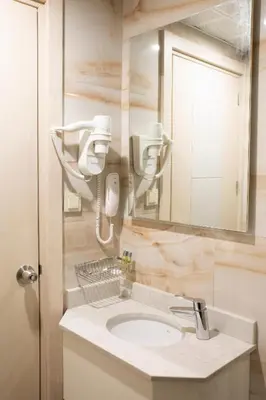 a bathroom with a sink and a mirror at Alpinn Hotel DUE in Istanbul