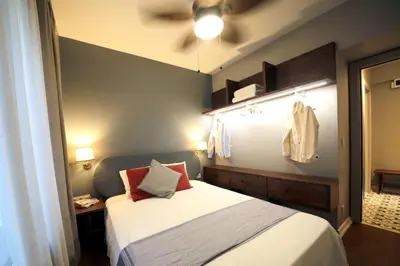 a bedroom with a bed and a ceiling fan at Superior refurbished flat in the heart of Istanbul in Istanbul