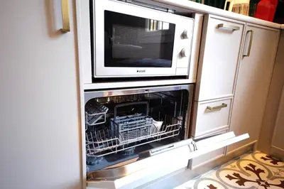 an open oven with a microwave on top of it at Superior refurbished flat in the heart of Istanbul in Istanbul
