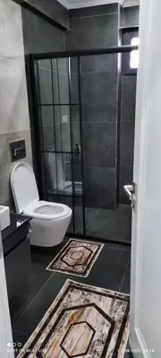 a bathroom with a toilet and a shower stall at Sapanca villa in Sapanca