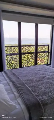 a bedroom with a bed and a view of the ocean at Sapanca villa in Sapanca