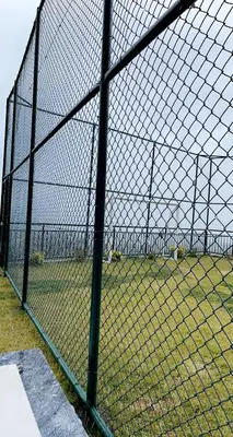 a chain link fence with a field behind it at Sapanca villa in Sapanca