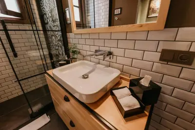a bathroom with a white sink and a mirror at Galadoo Suites 2nd Floor in Istanbul