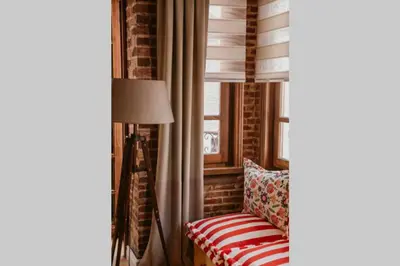 a living room with a couch and a window at Galadoo Suites 2nd Floor in Istanbul