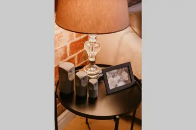 a table with a lamp and a picture on it at Galadoo Suites 3rd Floor in Istanbul