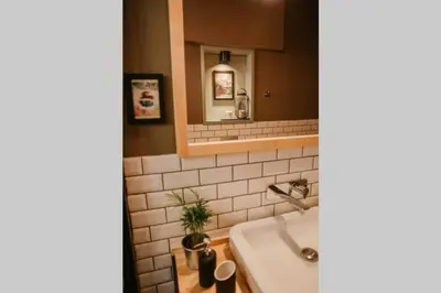 a bathroom with a sink and a mirror at Galadoo Suites 3rd Floor in Istanbul