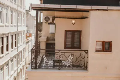 a balcony of a building with a table on it at Galadoo Suites 4th Floor in Istanbul