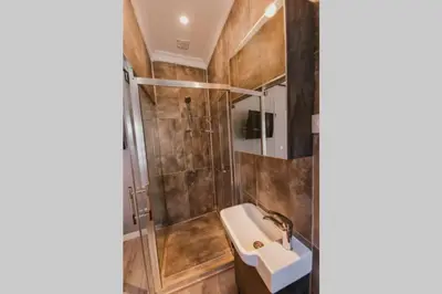 a bathroom with a sink and a shower at Galadoo Suites 4th Floor in Istanbul