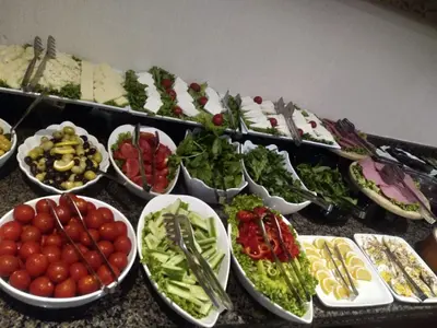 a table topped with bowls of different types of food at Hotel Le Mirage in Istanbul