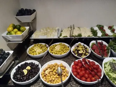 a buffet with bowls of different types of food at Hotel Le Mirage in Istanbul
