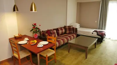 a living room with a couch and a table at TALEN OTEL in Istanbul