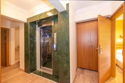 a bathroom with a shower and a glass door at Bazaar Hotels Old City in Istanbul