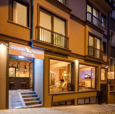 a building with a green premier homes sign on it at Green Parrot Hotel Istanbul in Istanbul