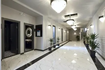 a hallway with potted plants in a building at Luxon Hotel Sakarya in Sakarya