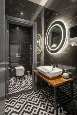 a bathroom with a sink and a mirror at Luxon Hotel Sakarya in Sakarya