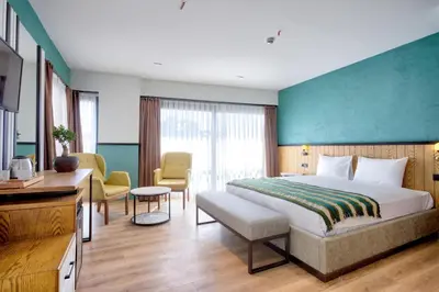a hotel room with a large bed and a desk at Fragments Hotel in Istanbul
