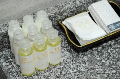 a group of bottles of oil on a counter at MİLLS HOTEL in Tekirdag