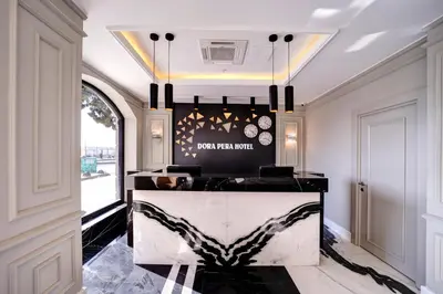a lobby with a black and white marble counter at Dora Pera Hotel in Istanbul